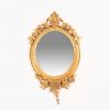 9237 - 19th Century Oval Carved Giltwood Mirror